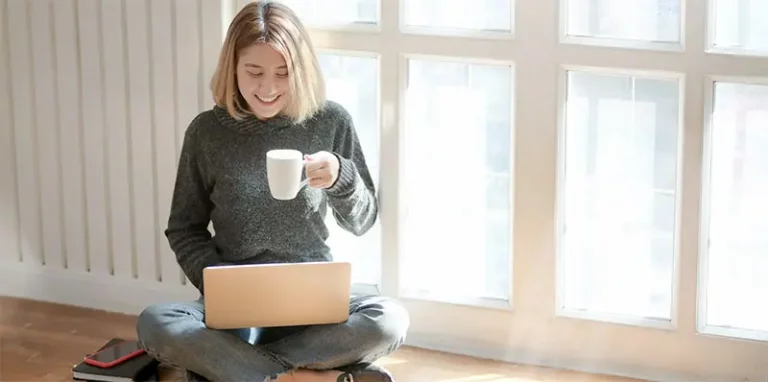 smiling woman with laptop