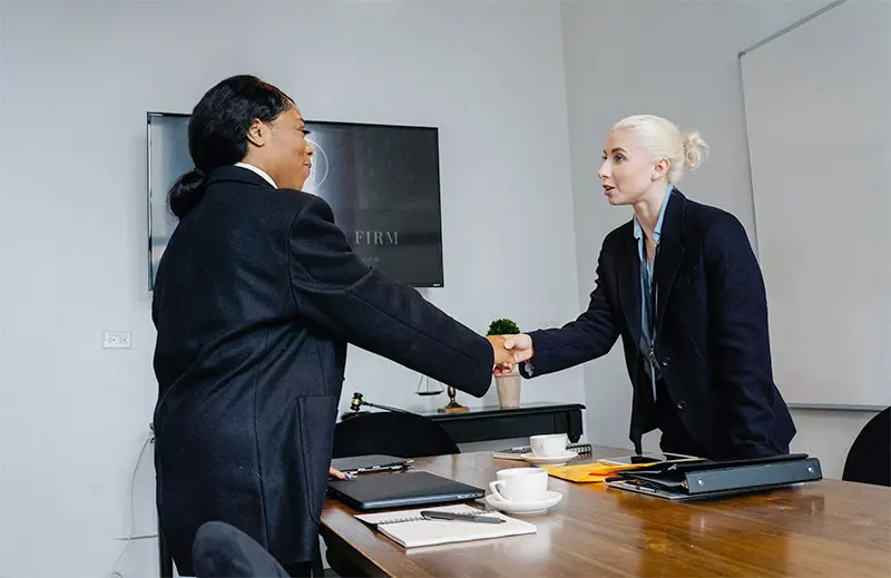 women shaking hands