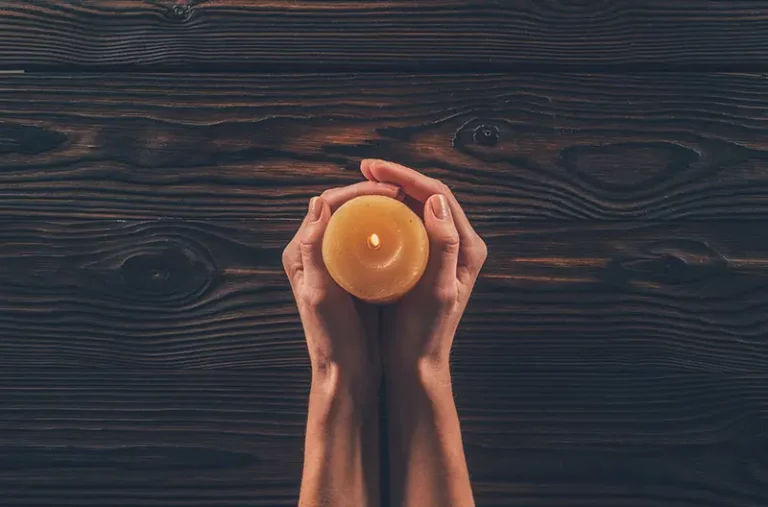 woman holding candle